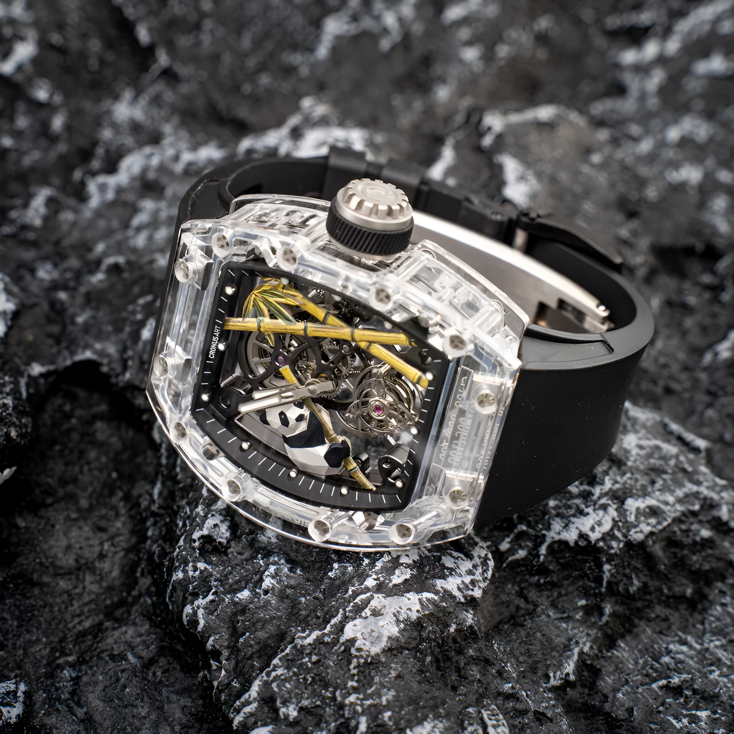 Cronusart CM08 030 Panda sapphire tourbillon watch on black strap photographed on dark rock texture showing transparent tonneau case and skeleton dial