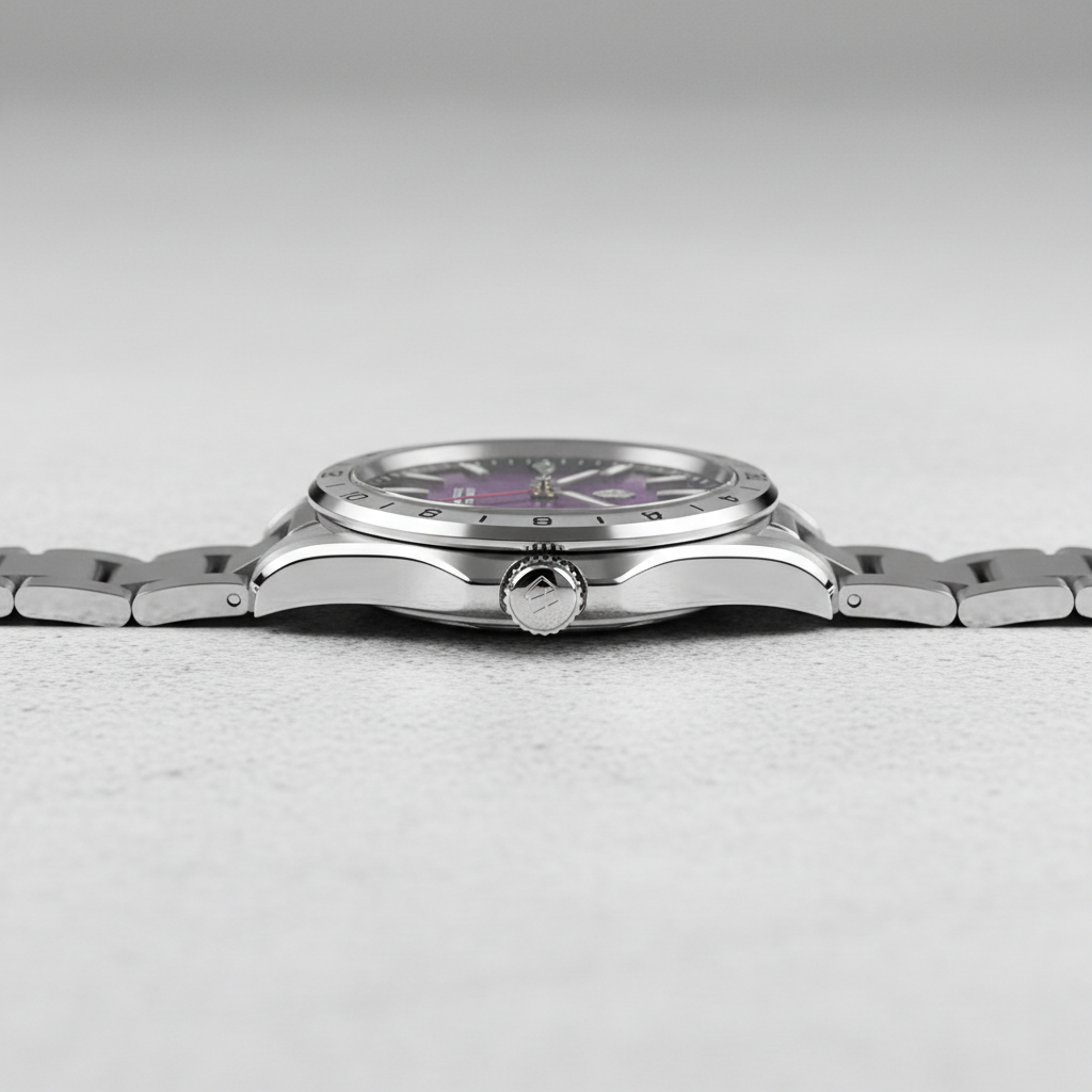 Silver watch with a purple face on a light gray background