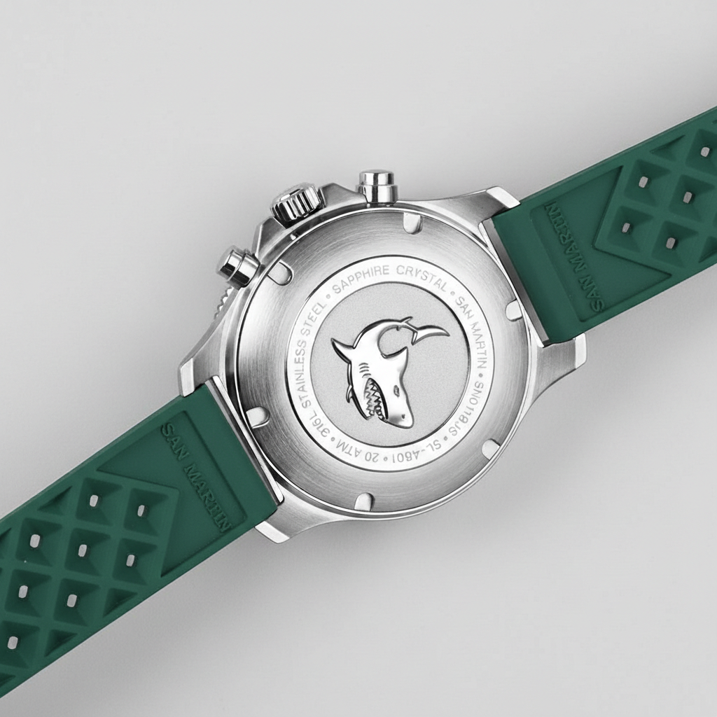 Watch with green strap and silver case on a light gray background