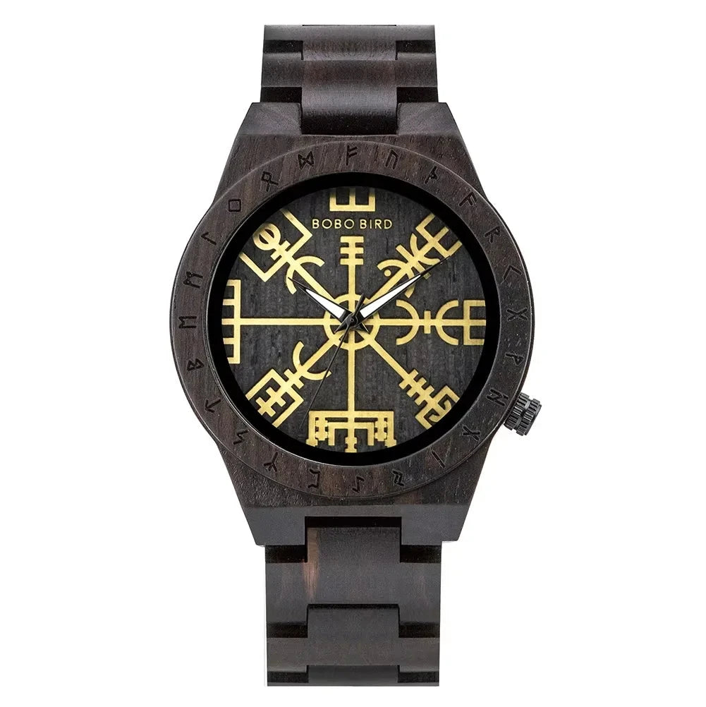 Wooden watch with a black face and gold symbols on a white background