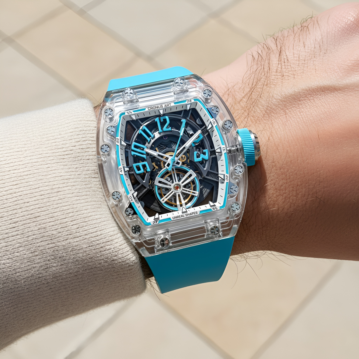 Cronusart CM001-081 Transparent Automatic Watch - Blue wristwatch with transparent case on a wrist against a neutral background