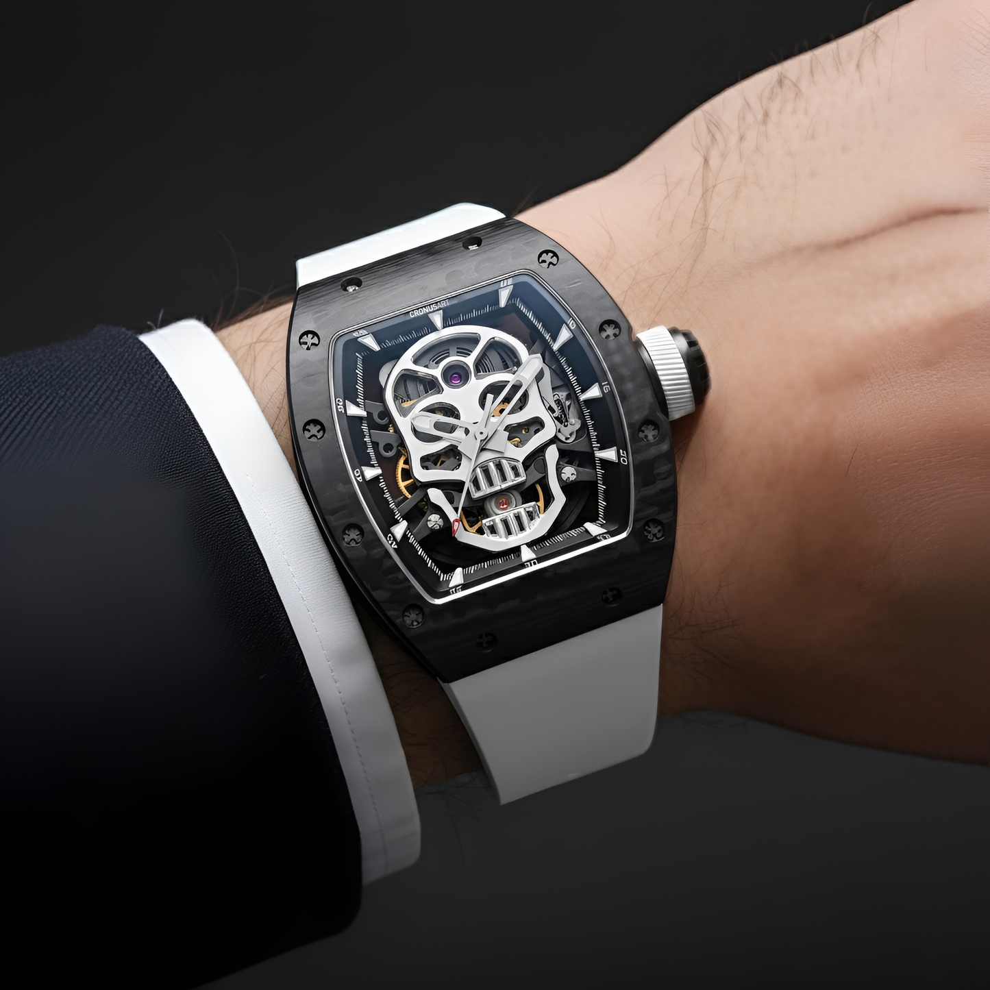 CRONUSART CM002-033 skeleton skull automatic watch worn on wrist with white strap and carbon fibre case