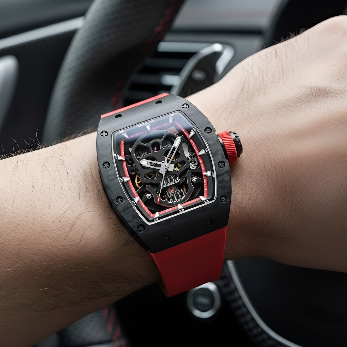 Men automatic skeleton skull watch CRONUSART CM002-033 on wrist with red strap and bold tonneau design