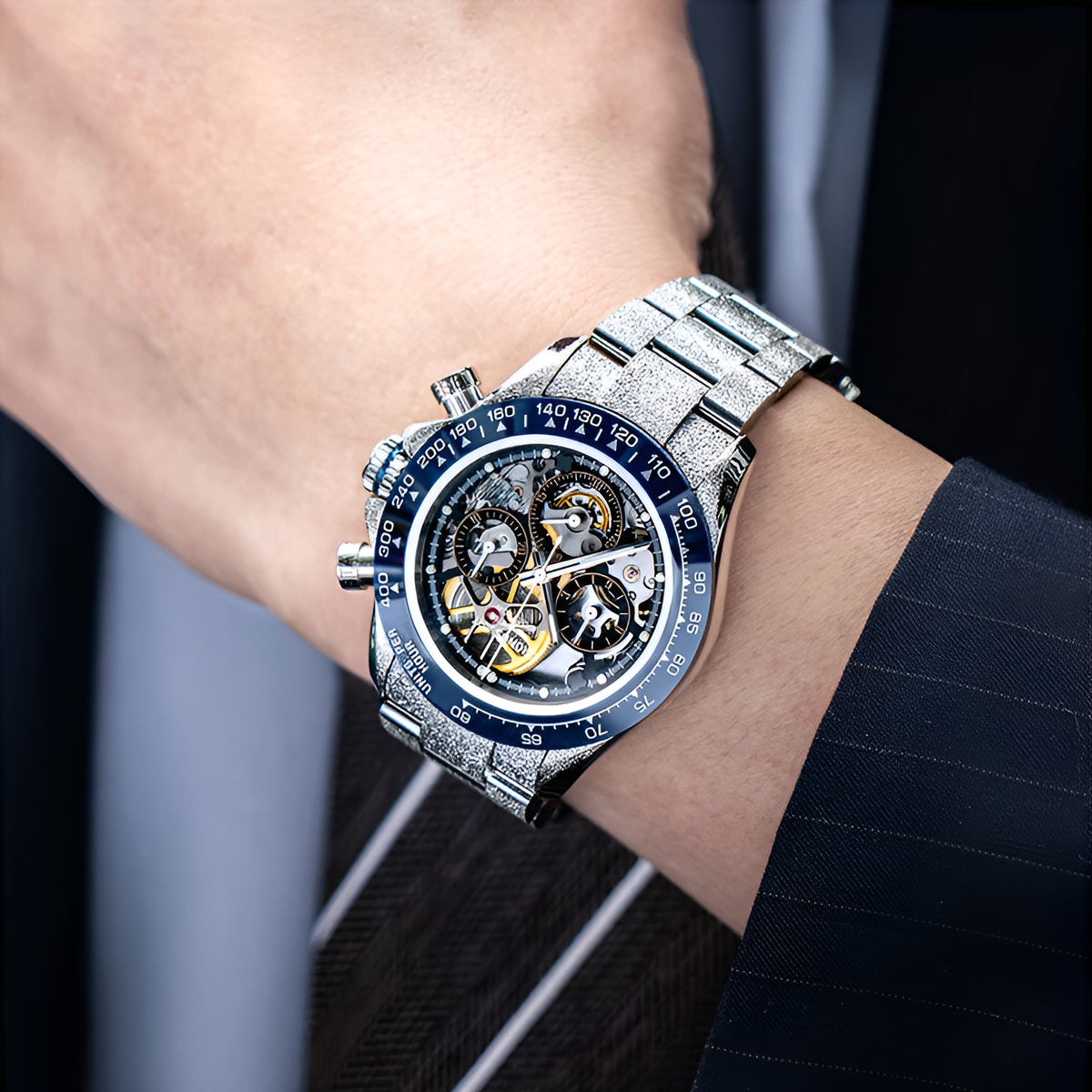 Cronusart CM015-011 - Automatic skeleton chronograph worn on wrist with ceramic bezel and steel bracelet