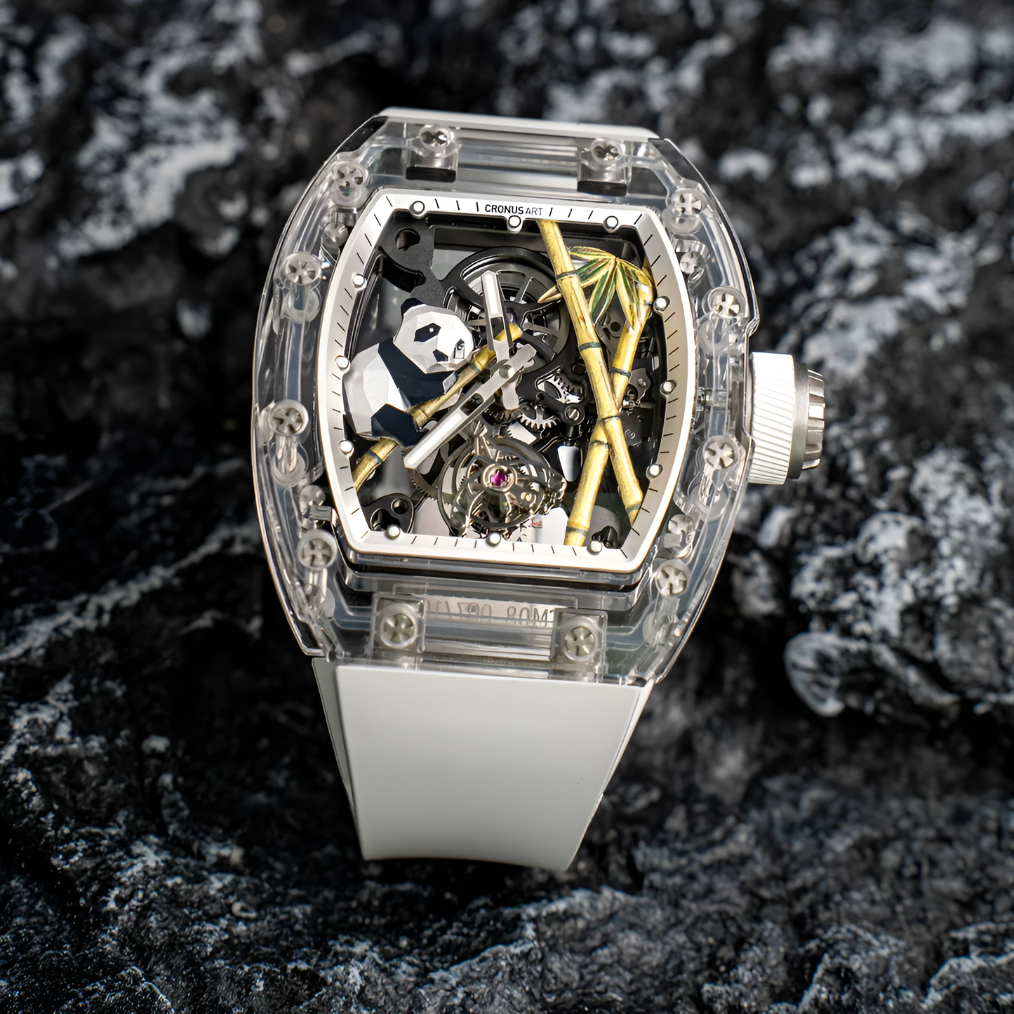 Cronusart CM08-030 - Panda sapphire tourbillon watch with white strap displayed on textured rock surface
