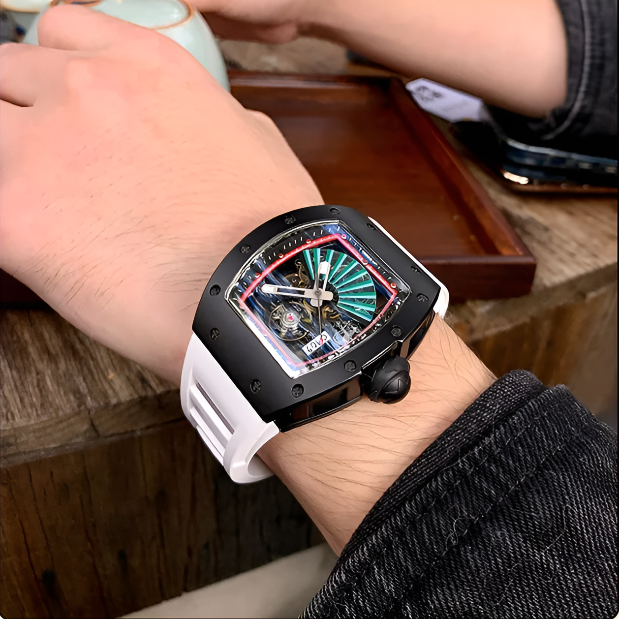Cronusart CM09-001 - Carbon steel skeleton watch with white strap worn outdoors during coffee preparation