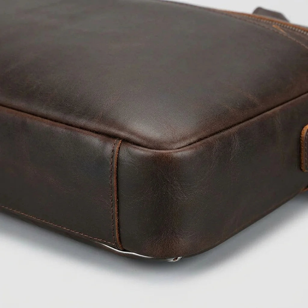 Men’s Leather Computer Briefcase — close-up of leather surface and base edge