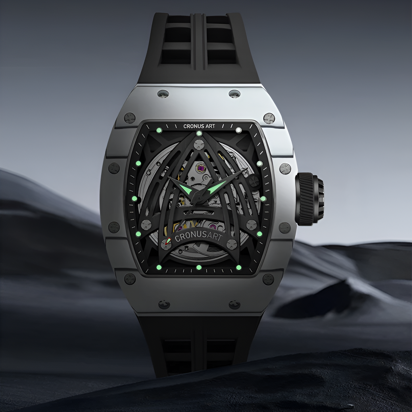 CRONUSART CM002-073 skeleton watch glowing in the dark, showing green luminous hands and hour markers against a dark grey carbon case.