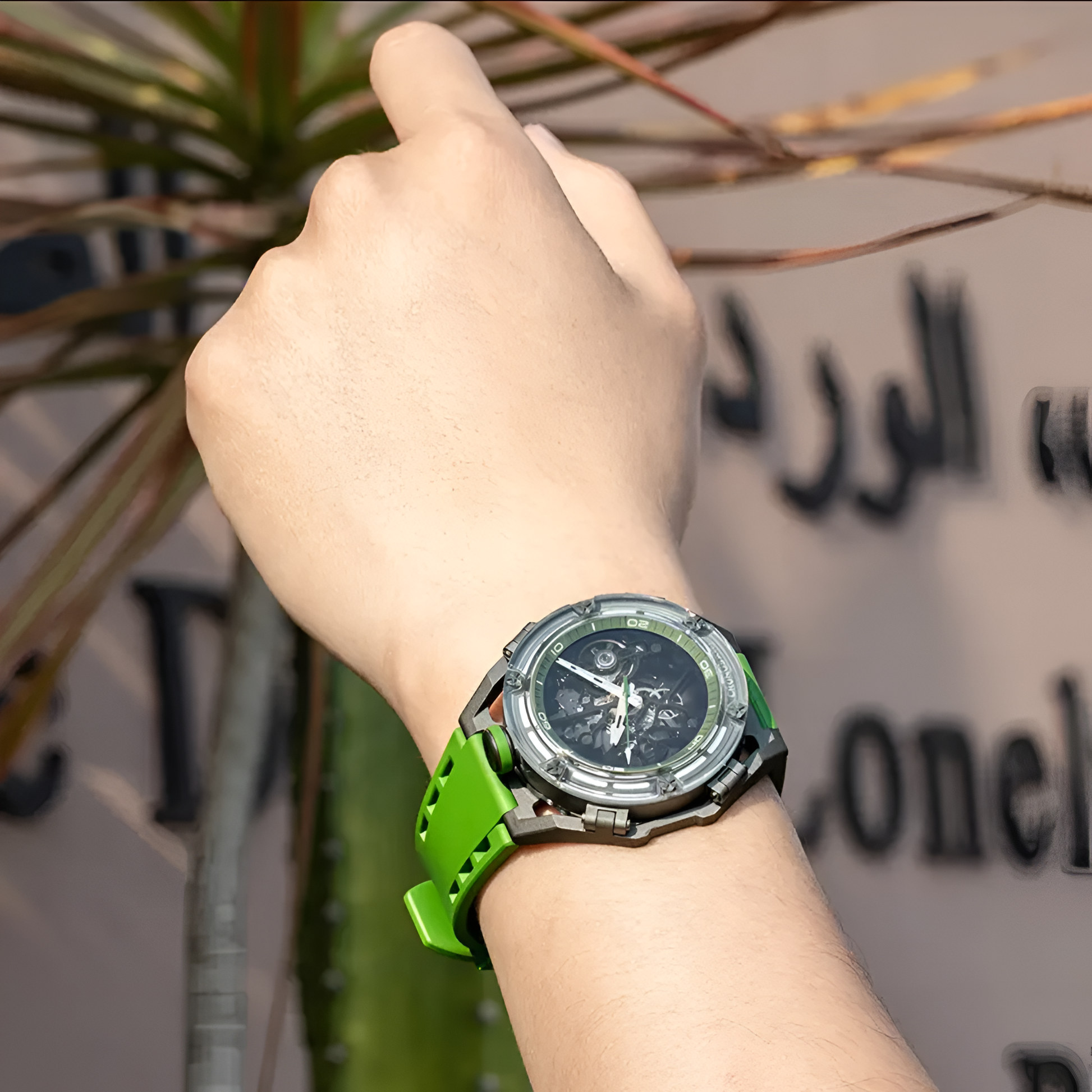 Lifestyle view of green CRONUSART CM025 mechanical watch on wrist.