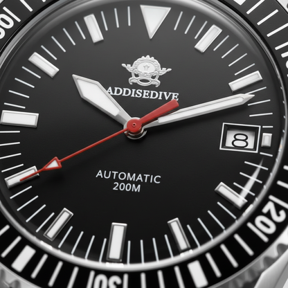 Close-up of a black watch face with white markings and red accents, featuring the brand 'Addisedive'.