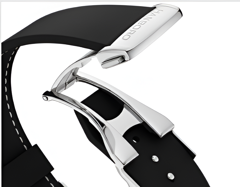 Close-up of a black watch strap with silver clasp on a white background