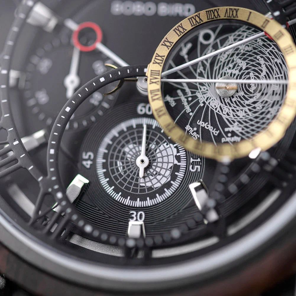Close-up of a detailed watch face with gold and black design elements.