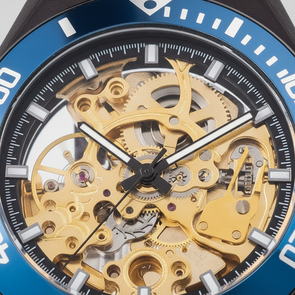 Close-up of a mechanical watch with gold gears and blue casing