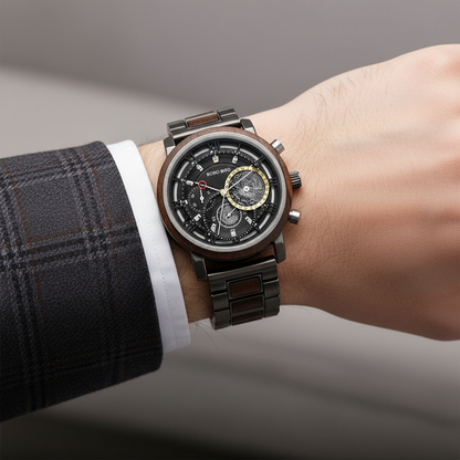 Close-up of a person wearing a detailed wristwatch with a gray background