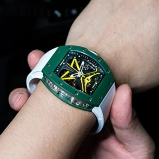Close-up of a wrist wearing a green and white watch with a detailed face.