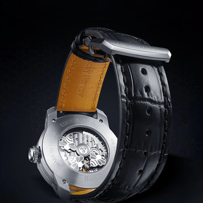 Exhibition case back showing Lucky Harvey automatic movement with bee engravings