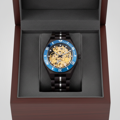 Luxury watch with blue and black strap in a wooden box