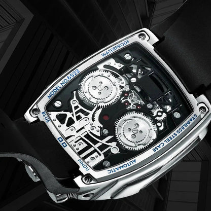PINDU P5023 watch displayed under cinematic light showing skeleton dial reflections