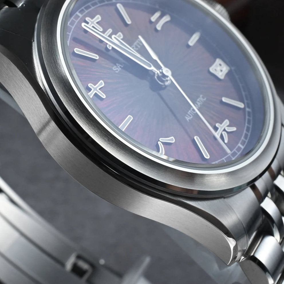 San Martin men’s automatic wristwatch with brown sunburst dial, polished case, and steel bracelet.