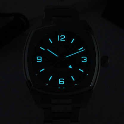 San Martin SN0026G Men’s Square GMT Automatic Watch in darkness showing blue luminous hour markers and hands glowing against the dial, emphasizing night visibility.