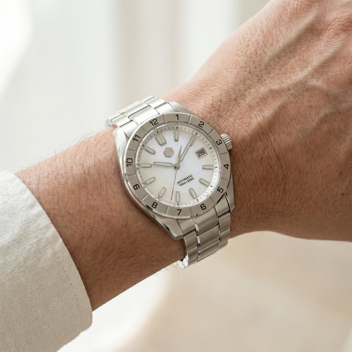 San Martin SN0130GB - Silver watch on a wrist