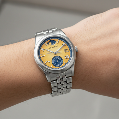 San Martin SN0144-DG automatic mechanical watch worn on wrist, showcasing yellow dial, power reserve complication, and stainless steel bracelet