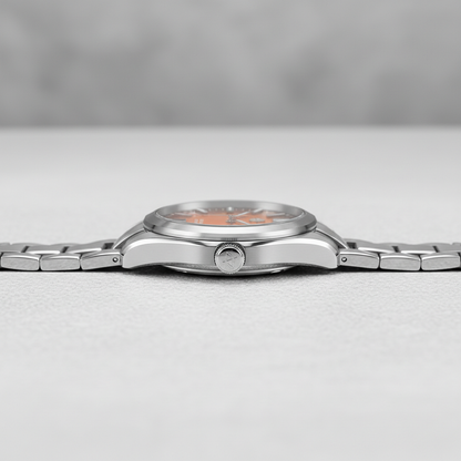 Silver wristwatch on a light gray background