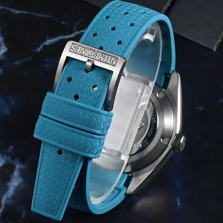 San Martin Horizon SN0144 men’s automatic watch with azure dial and brushed stainless-steel case on marble background.