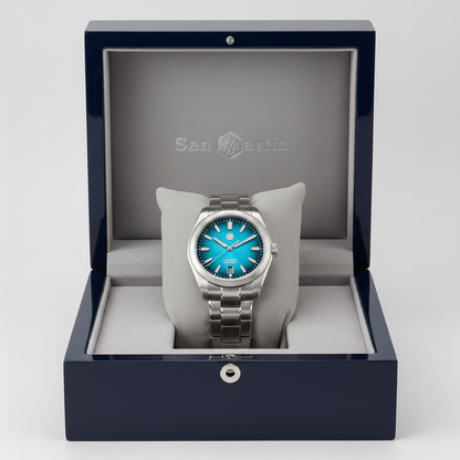 Watch with blue face and silver case in an open box with 'San Martin' branding.