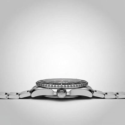 Silver watch with a detailed case on a light gray background
