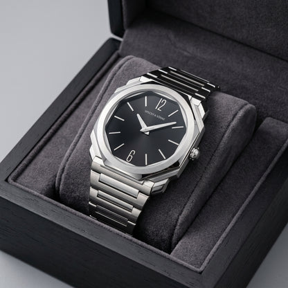 Silver watch with black dial in a gray box