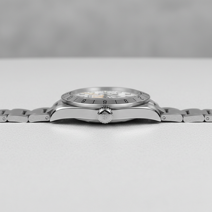 Silver wristwatch on a light gray background