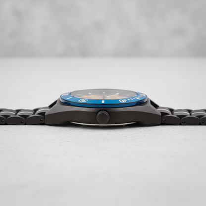 Watch with a blue face and black strap on a light gray background