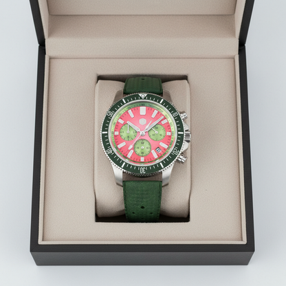 Watch with green strap and pink face in an open box on a white background