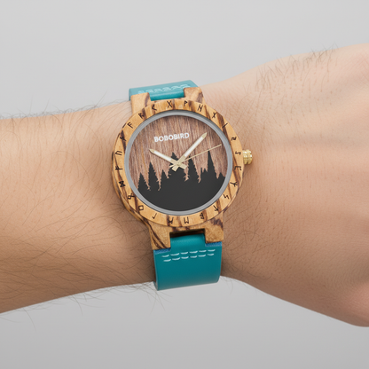 Wooden watch with a blue strap on a wrist against a neutral background