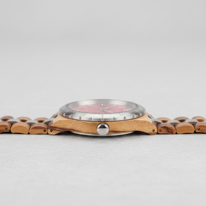 Wooden watch with a silver case on a light gray background