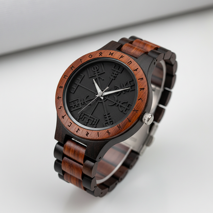 Wooden watch with black face and detailed design on a white background