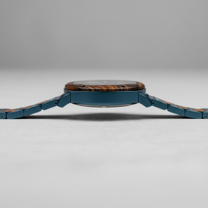 Wristwatch with blue metal strap and wooden face on a gray background