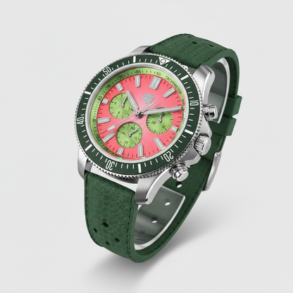 Wristwatch with green strap and pink face on a light gray background