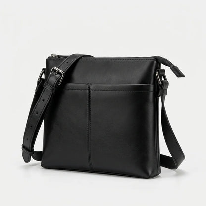Men's Slim Black Leather Crossbody Bag — three-quarter view with shoulder strap