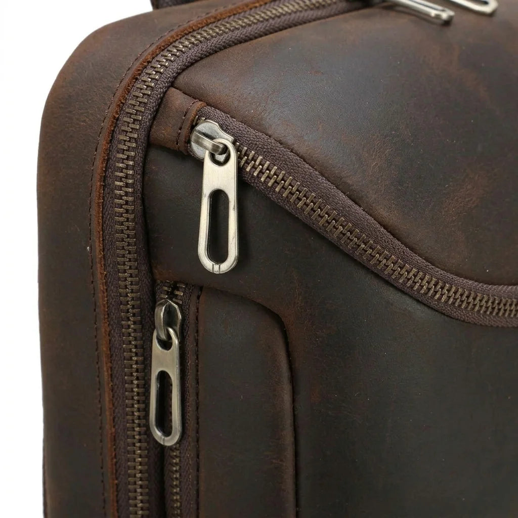 Men's Crazy Horse Leather Tablet Sling Bag — close-up of zippers and leather texture