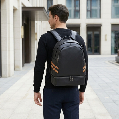 Men's Full-Grain Leather Backpack with Insulated Bottom Compartment — worn on the back by a man in a black knit shirt, rear view