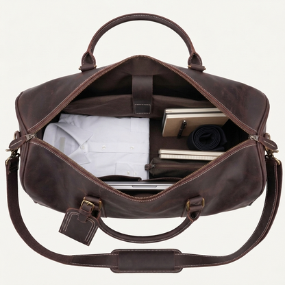 Men's Full-Grain Leather Duffle Bag with Luggage Tag — open from above with a shirt, notebooks and a laptop inside