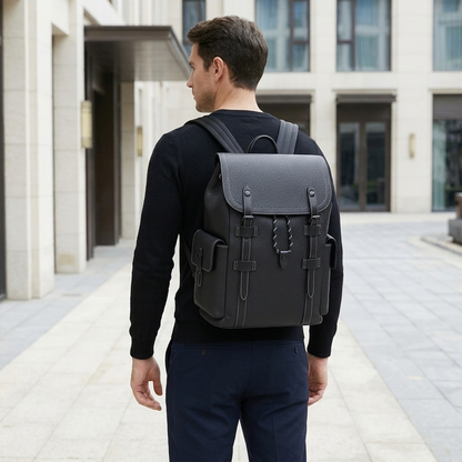 Men's Full-Grain Leather Flap Backpack with Drawstring Closure — worn on the back by a man in a black knit shirt, rear view