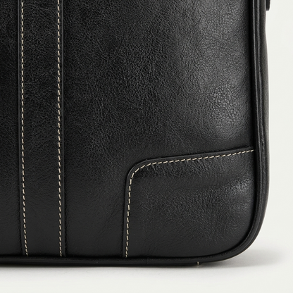 Men's Full-Grain Leather Slim Business Briefcase — close-up of the leather corner and stitching