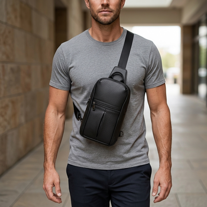 Men's Full-Grain Leather Sling Chest Bag — worn crossbody by a man in a grey T-shirt