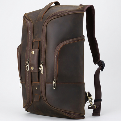 Men's Full-Grain Leather Travel Backpack with Hideaway Straps — three-quarter front view