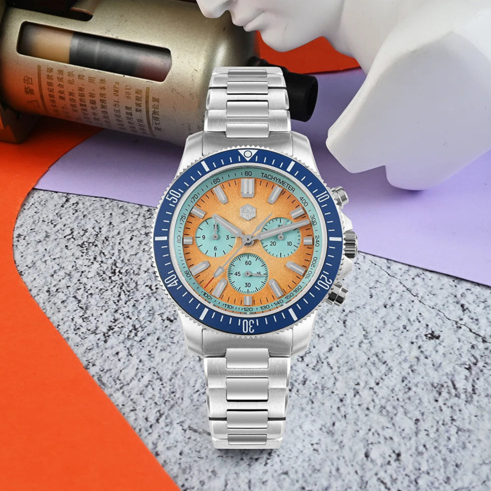 San Martin Chronograph Diver watch glowing with BGW-X1 blue and orange luminous accents.
