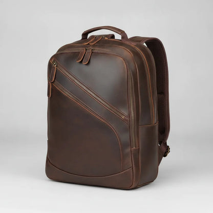 Leather Multi-Pocket Travel Backpack — three-quarter front view on a light grey background