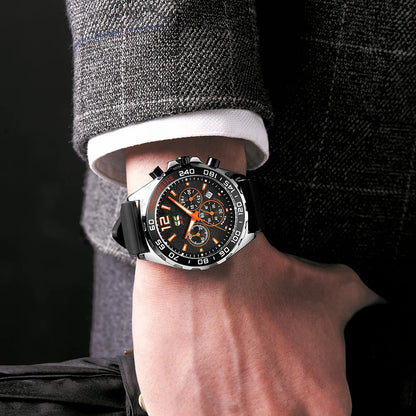 XENTHARIS black chronograph watch worn on a man’s wrist with a suit, illustrating its elegant and versatile business-ready style.